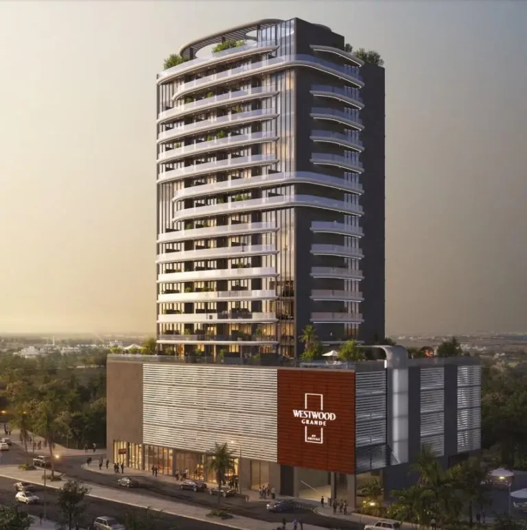 Westwood Grande modern residential complex with sunset background, urban view, stylish architecture.