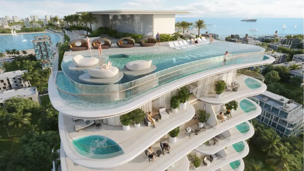 Gratte-ciel de luxe avec piscine sur le toit et vue sur la mer : architecture et équipements pour un style de vie élégant.