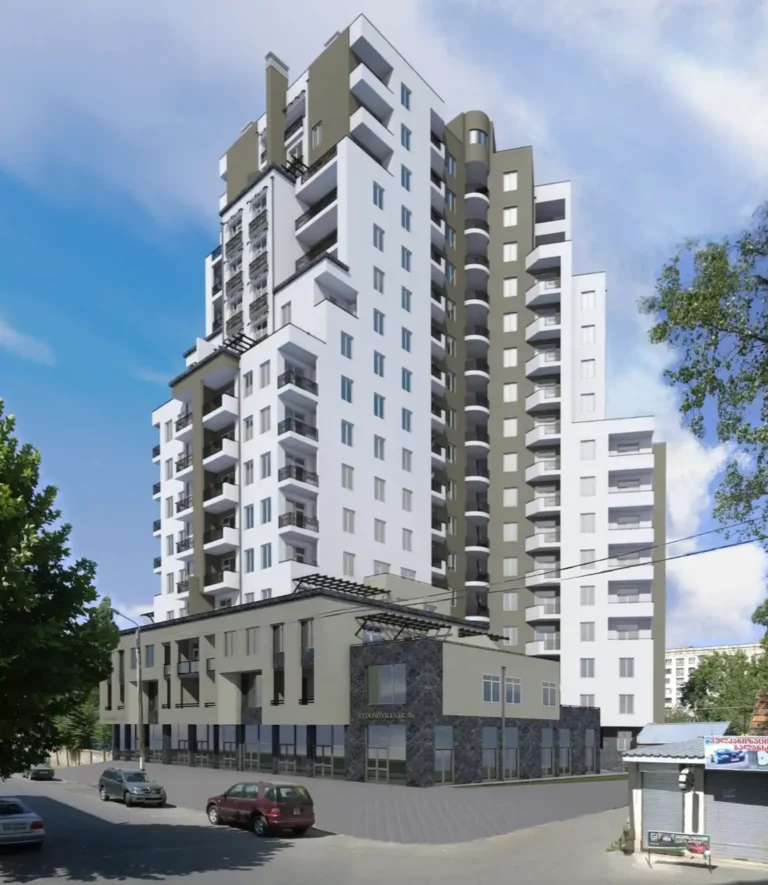 Modern residential complex with multi-storey buildings against a clear sky, cityscape.