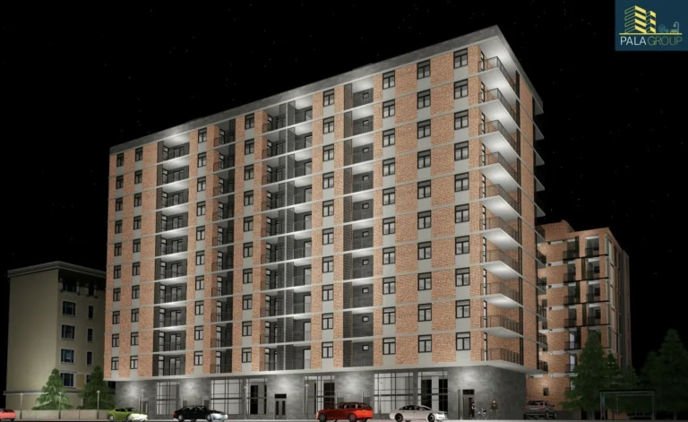 Modern residential building at night, illuminated facades and balconies, brick and glass architecture.