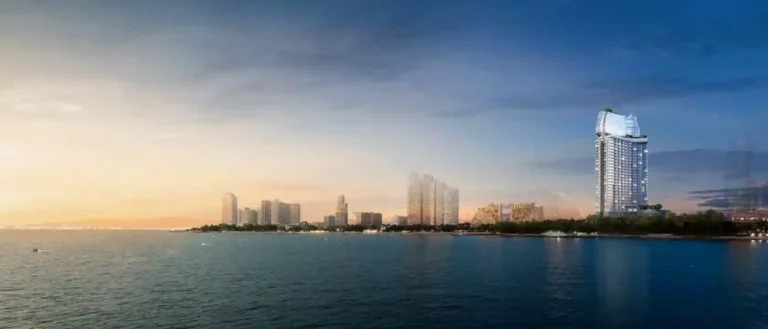 Vista panorâmica da cidade moderna e do mar ao pôr do sol, edifícios altos no horizonte, a tranquilidade e a harmonia da natureza.