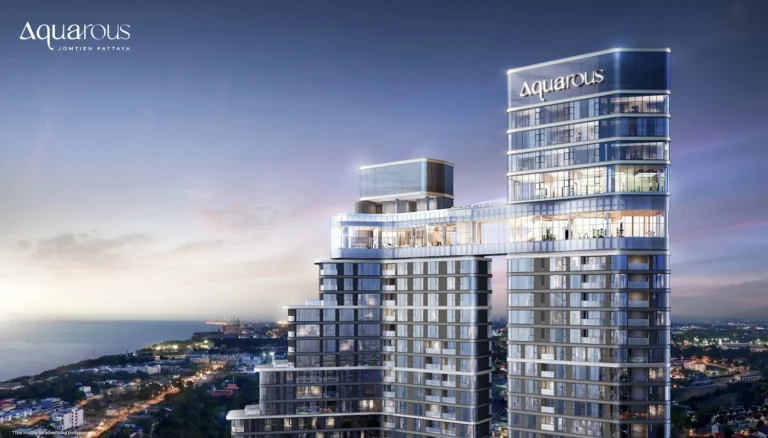 A view of the Aquarous Jomtien modern high-rise buildings in Pattaya against the evening sky.