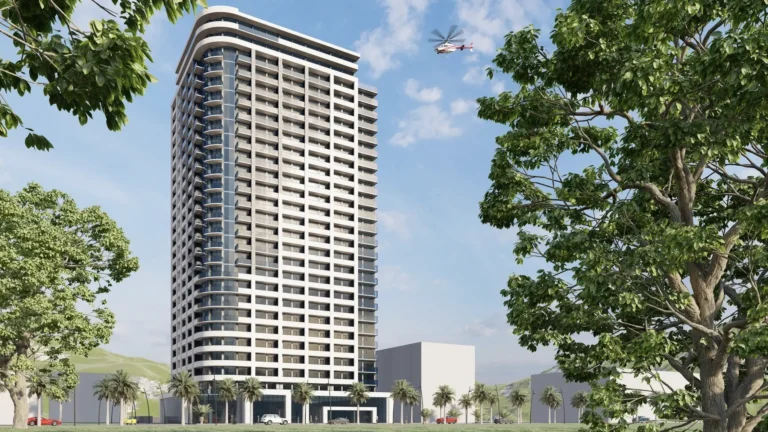 A tall modern building against a clear sky, surrounded by trees and palm trees.