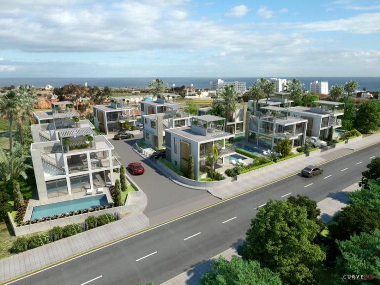 Modernas villas con piscina con vistas al mar, rodeadas de vegetación y palmeras.