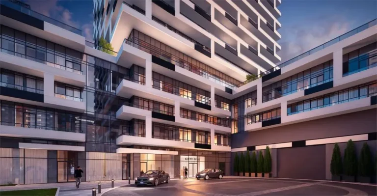 Modern apartment complex, facade with large windows, evening, two cars at the entrance.