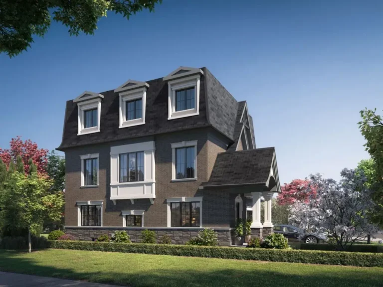 Three-story brick house with attic, surrounded by trees and green grass, on a sunny day.