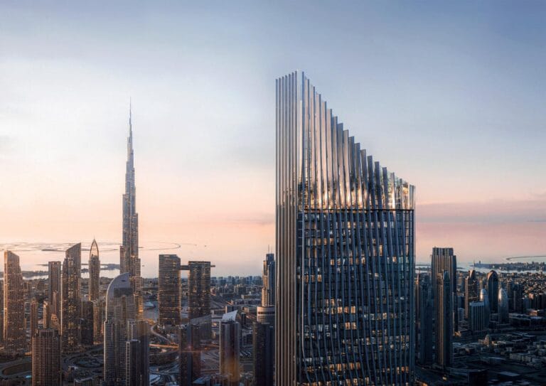 Modern skyscrapers in Dubai against the backdrop of sunset, including the Burj Khalifa, a distinctive urban panorama.