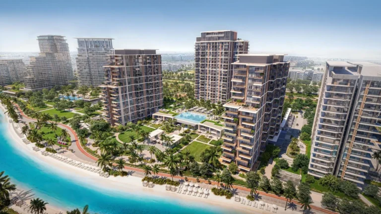 Modern high-rise buildings by the beach with palm trees and pools within the apartment complex.