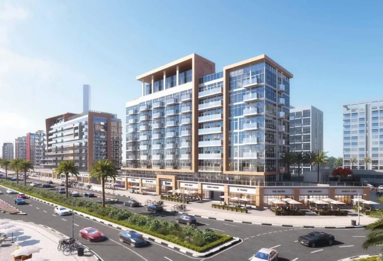 Modern office buildings and a busy city street with palm trees and parking lot, daytime view.