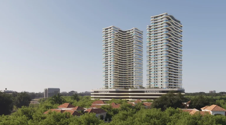 Samana's high-rise buildings amidst greenery and small structures against the blue sky.