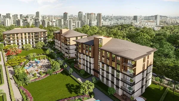 A modern residential complex with a park and swimming pool, surrounded by greenery, against the backdrop of the city landscape.