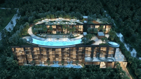 Moderní hotelový resort v deštném pralese se střešním bazénem a večerním osvětlením.